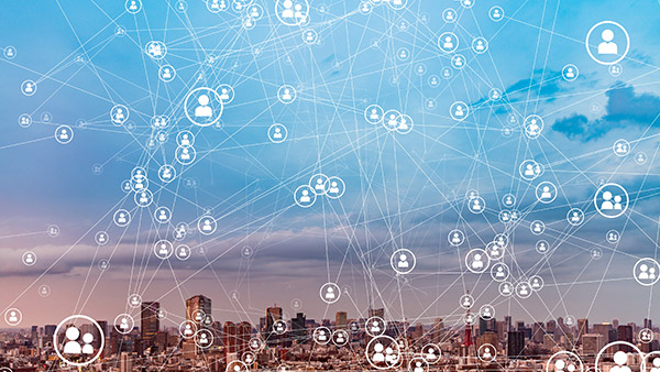 A city skyline showing a network of interconnected people from different locations